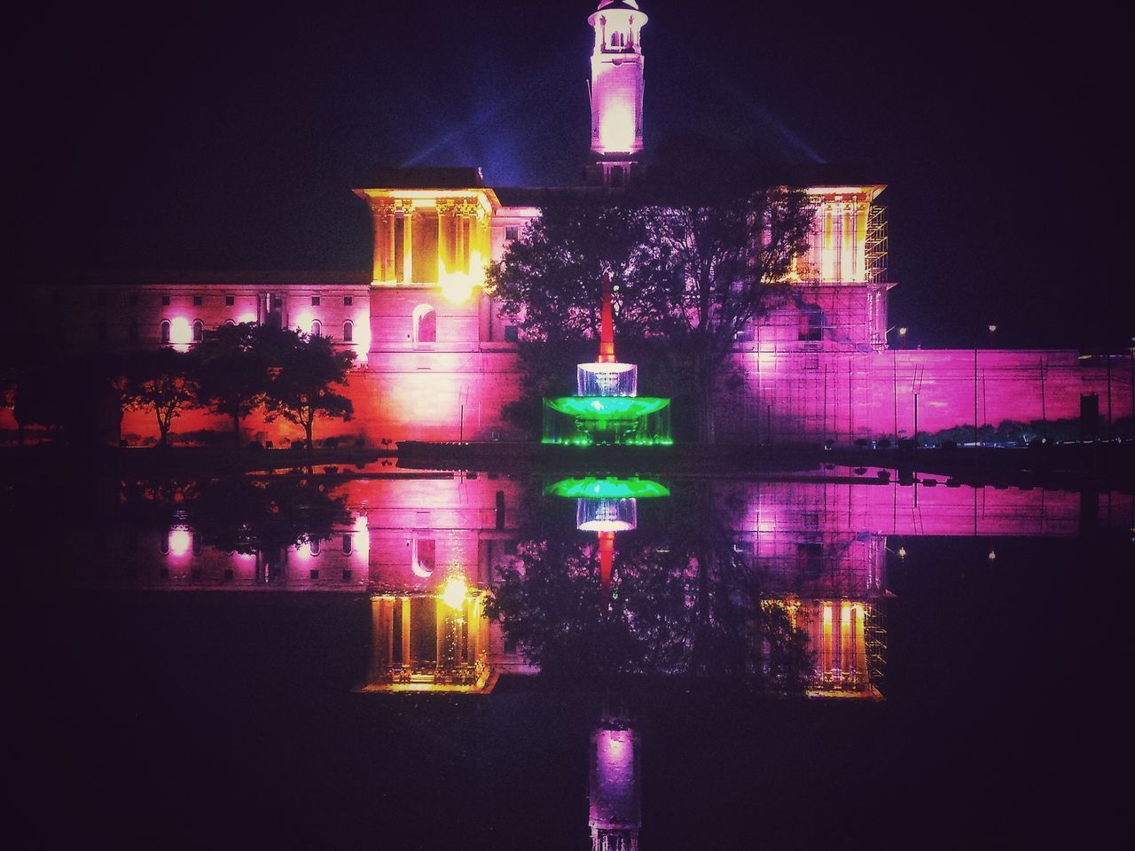 ILLUMINATED BUILDING AGAINST SKY