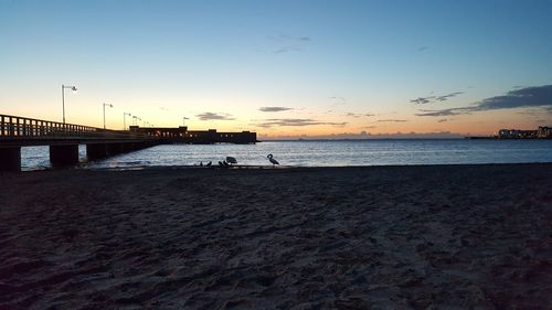 Scenic view of sea against sky at sunset