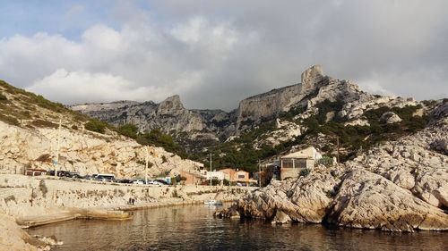 Panoramic view of sea and mountains against sky