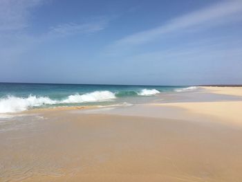 Scenic view of beach against sky