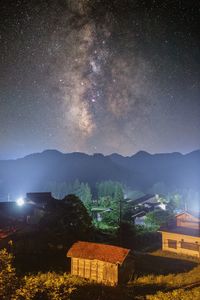 Scenic view of mountains against sky at night