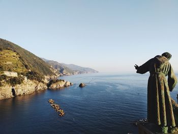 Scenic view of sea against clear blue sky