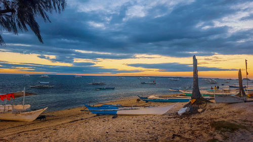 Scenic view of beach against sky during sunset