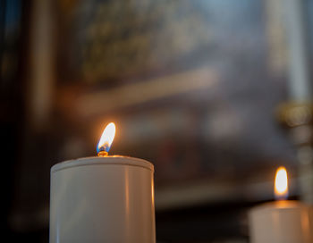 Votive candles lit in church