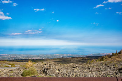 Scenic view of landscape against blue sky