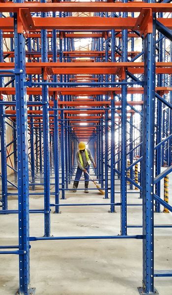 FULL LENGTH REAR VIEW OF MAN WORKING IN BUILDING