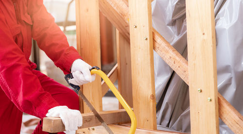 Low section of man working at workshop