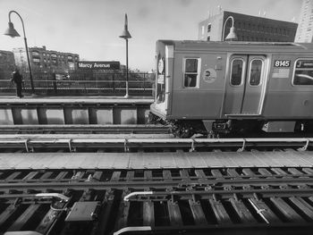 Side view of cropped train at railway station