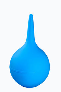 Close-up of blue balloons against white background