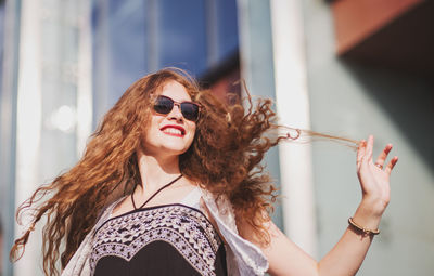 Portrait of young woman wearing sunglasses