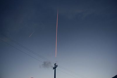 Low angle view of vapor trail against sky