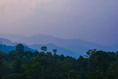 Scenic view of mountains against sky at sunset