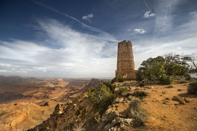 Low angle view of rock formation against sky