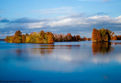 Scenic view of lake against sky during autumn