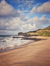 Scenic view of beach against sky