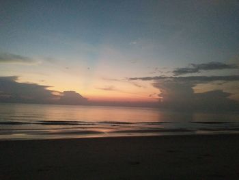 Scenic view of sea against sky at sunset