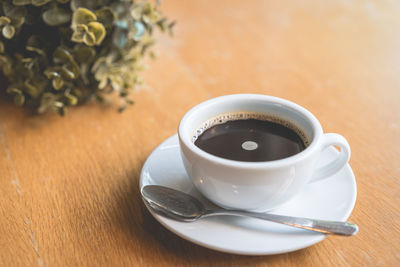 High angle view of coffee cup on table