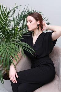 Portrait of smiling young woman looking away