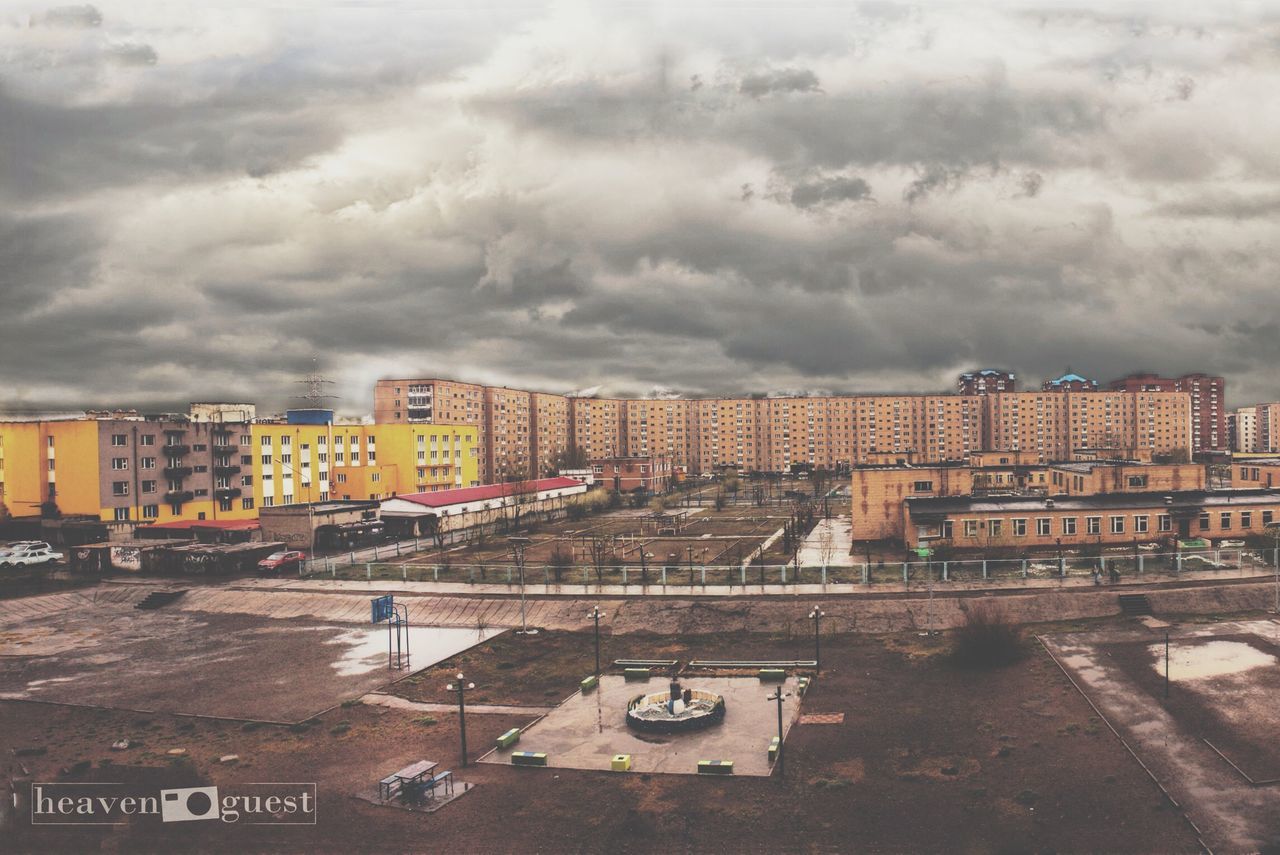 architecture, building exterior, built structure, sky, cloud - sky, cloudy, transportation, city, weather, street, road, overcast, land vehicle, car, mode of transport, residential building, residential structure, cloud, outdoors, day