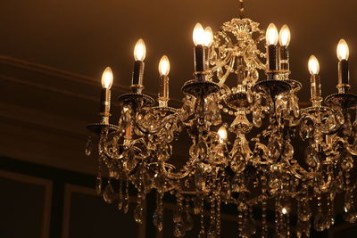 Low angle view of illuminated chandelier