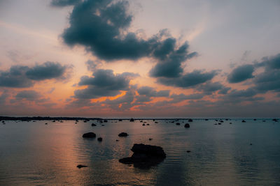 Scenic view of sea against sky at sunset