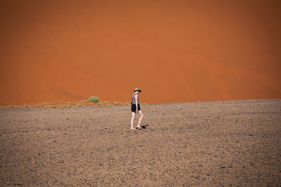 Full length of woman standing on shore at night