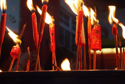 Close-up of burning candles