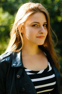 Portrait of young woman in sunny day