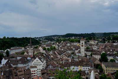 Houses in town against sky