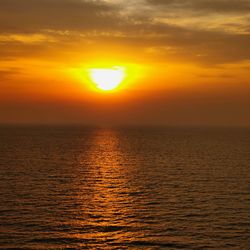 Scenic view of sea against romantic sky at sunset
