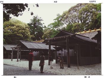 View of people walking through window
