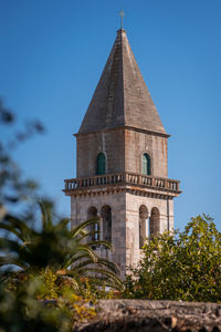 Low angle view of church against clear blue sky