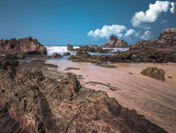 Panoramic view of rock formations against sky