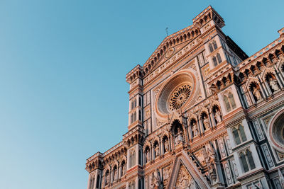 Low angle view of florence cathedral against clear blue sky