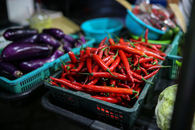 Red chili peppers for sale at market stall