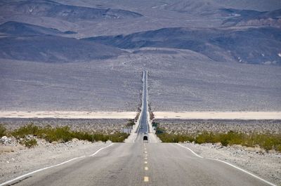 Road leading towards mountain