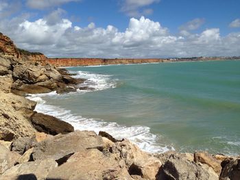 Scenic view of sea against cloudy sky