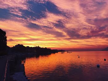 Scenic view of sea against orange sky