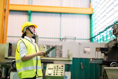 Factory worker check stock on tablet