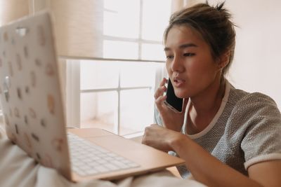 Young woman using mobile phone