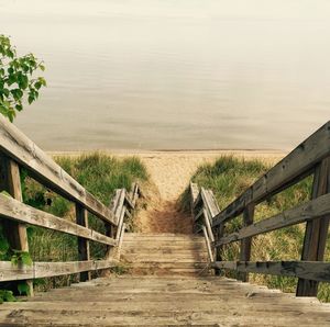 Wooden footbridge over river