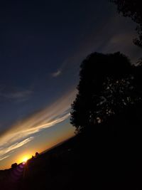 Low angle view of silhouette trees against sky during sunset