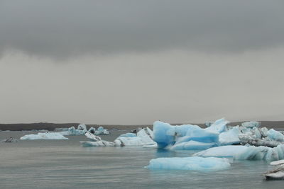 Scenic view of frozen sea against sky