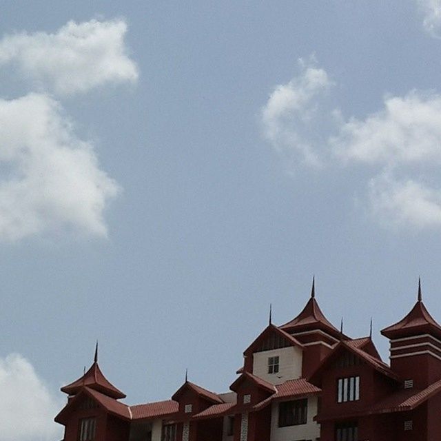 architecture, building exterior, built structure, low angle view, sky, roof, high section, place of worship, cloud - sky, cloud, religion, blue, spirituality, outdoors, day, house, no people, temple - building, cloudy, residential structure