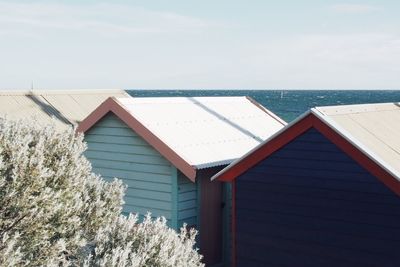 Snow covered cabins on beach