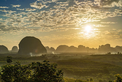 Scenic view of landscape against sky during sunset