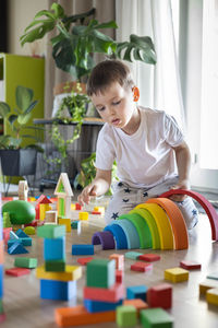 Boy playing with toy blocks