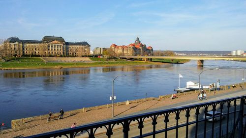 Bridge over river with buildings in background