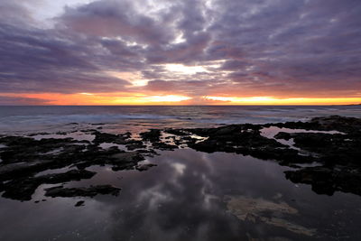 Scenic view of sea against sky during sunset