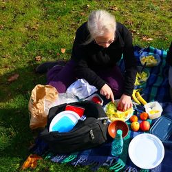 High angle view of woman with food at park
